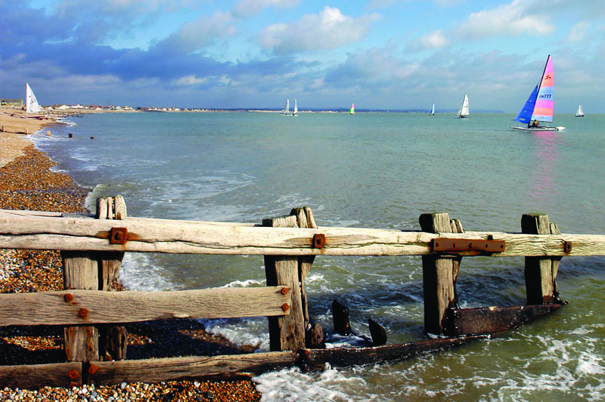 Sailors at Pevensey with groyne in foreground